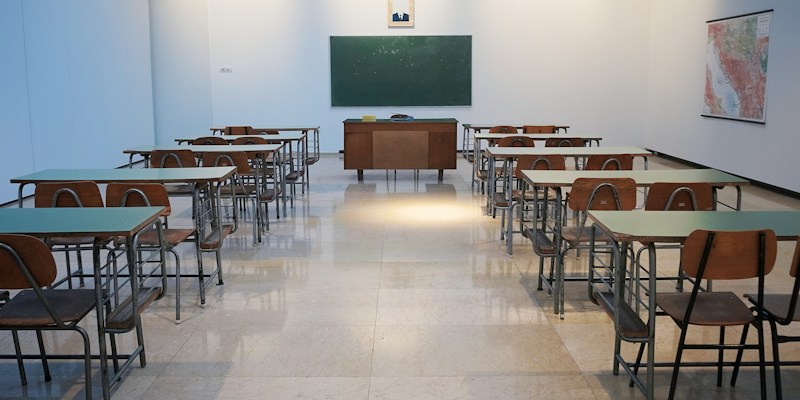 School timetable coordinator planning teacher room ownership and floating classroom allocation on a 